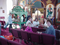 The woman of the church decorate the tomb.