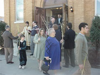 The people of the church start off the procession.
