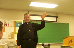 Father Andrew in the classroom.