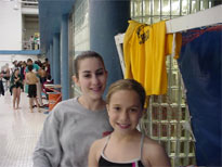 The girls swim team pauses for a picture.