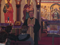 Archpriest Andrew Harrison talks to out Lutheran guests.