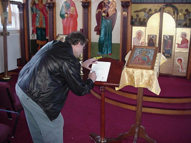 Michael Bauml signing the contract.