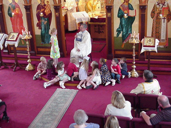 Father Andrew proposed a deal during the children's sermon.