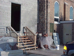 Temporary entrance and old brickwork removed..