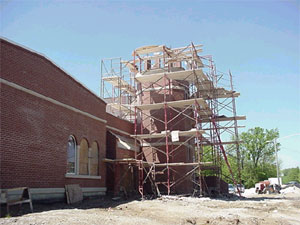Work continues on top of bell tower.