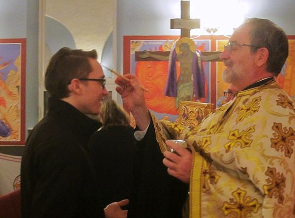 Father Paul anoints parishioner with the Oil of Holy Unction .